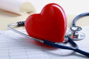 Red heart and a stethoscope on cardiagram