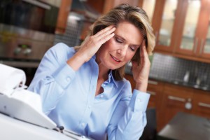 Woman having headache migraine.