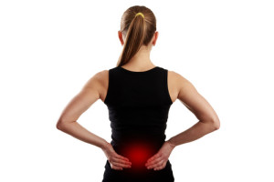 Fitness woman suffering from lumbar pain.