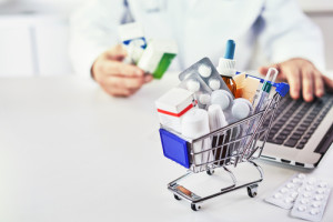 Medicines in shopping cart on desk of a drugstore